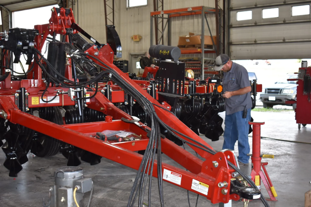 Man inspecting trailer farm equipment